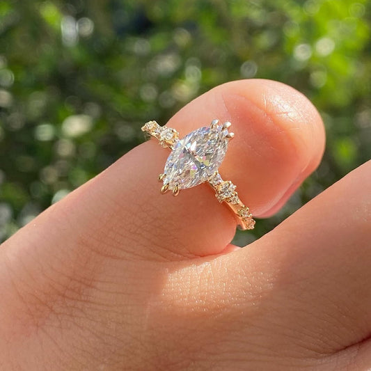 Marquise engagement ring worn on the hand in natural light