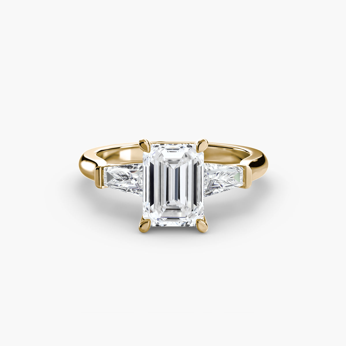 Evangeline Emerald Three-Stone Baguette in yellow gold