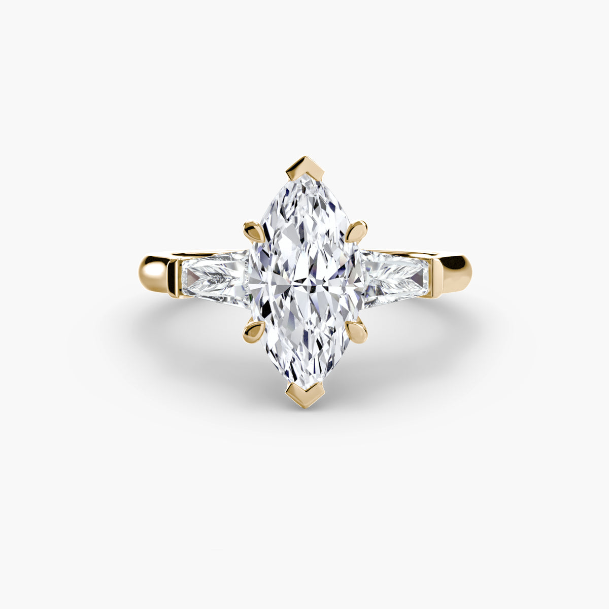 Oriane Marquise Three-Stone Baguette in yellow gold
