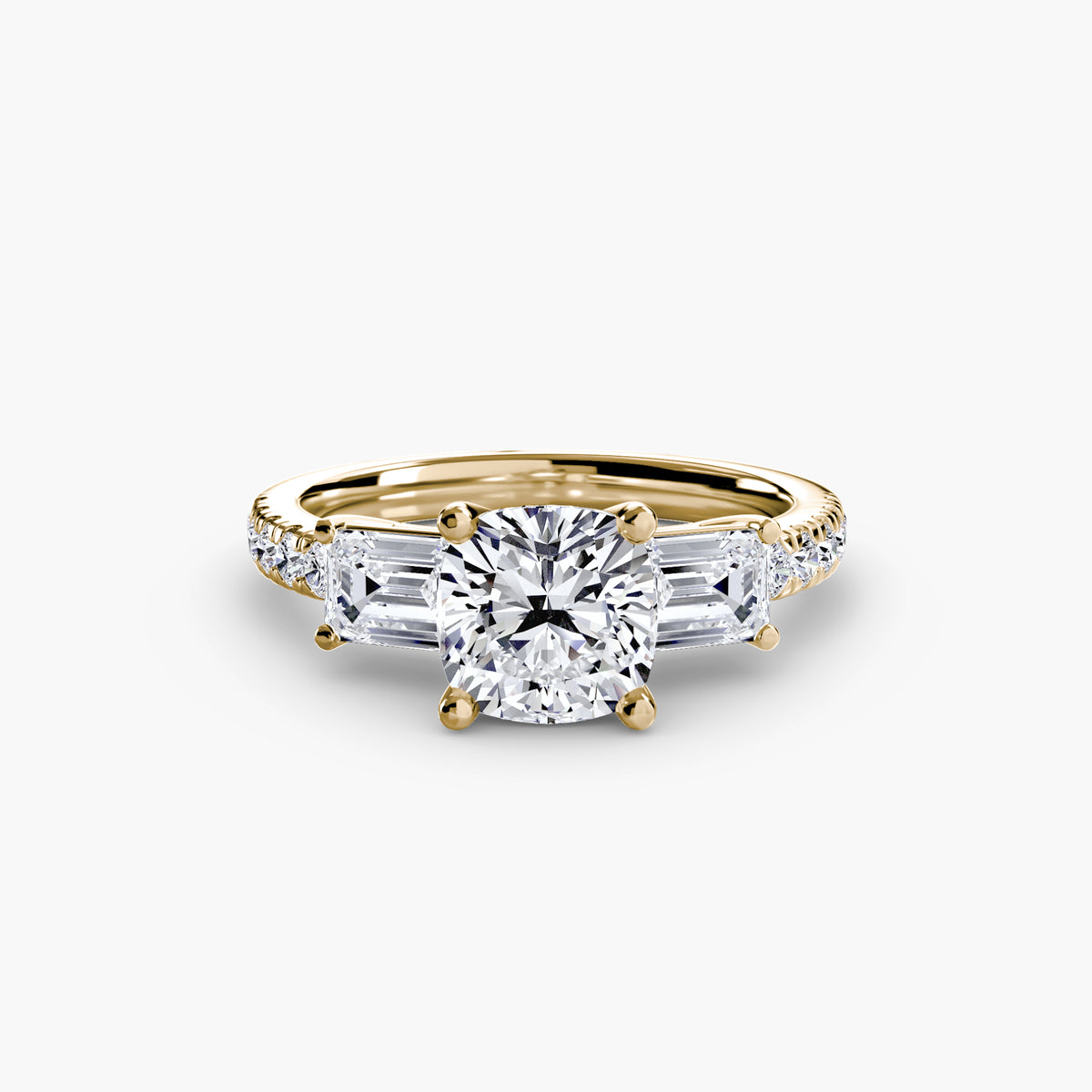 Delia Cushion Grand Three-Stone in yellow gold