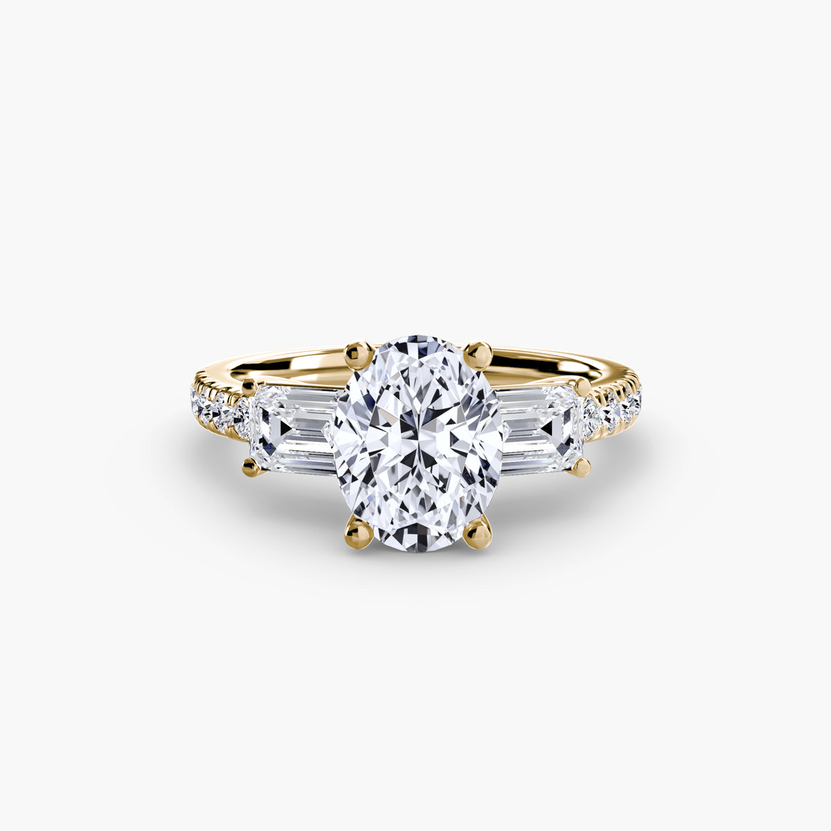 Hazel Oval Grand Three-Stone in yellow gold