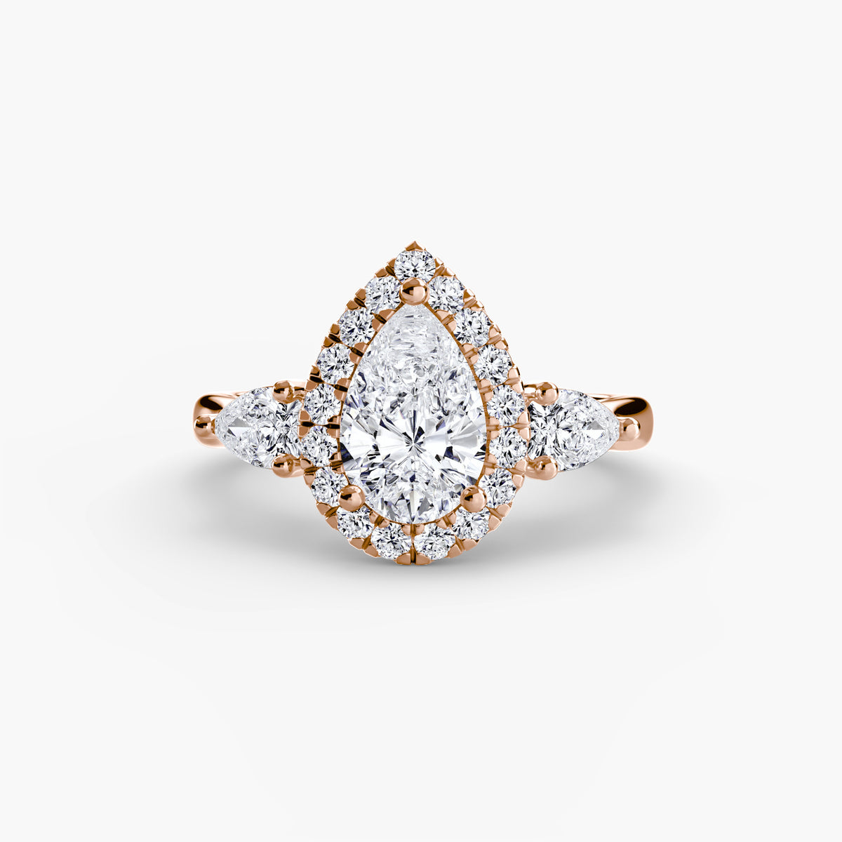 Isolde Pear Three-Stone Halo in rose gold
