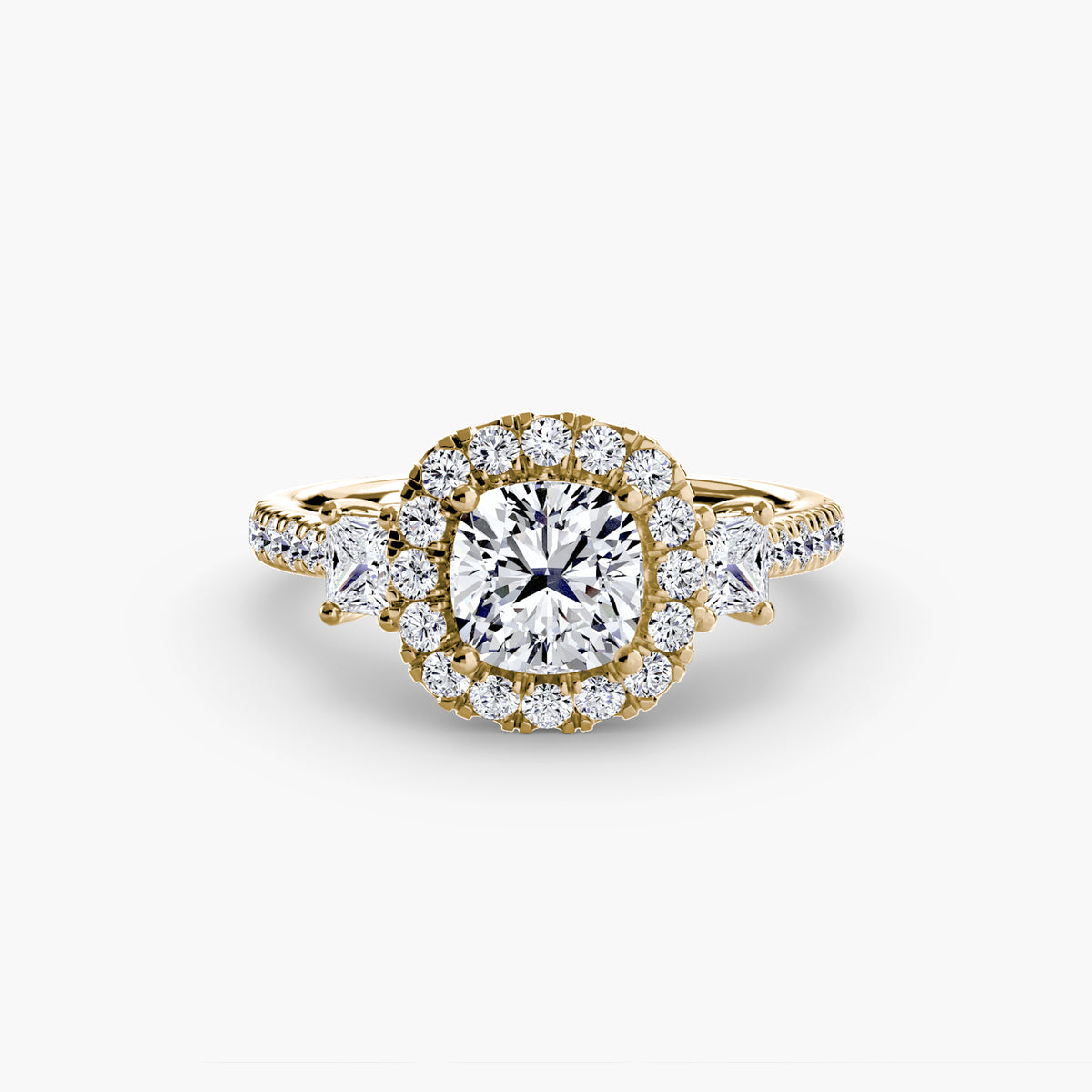 Lucie Cushion Three-Stone Halo in yellow gold