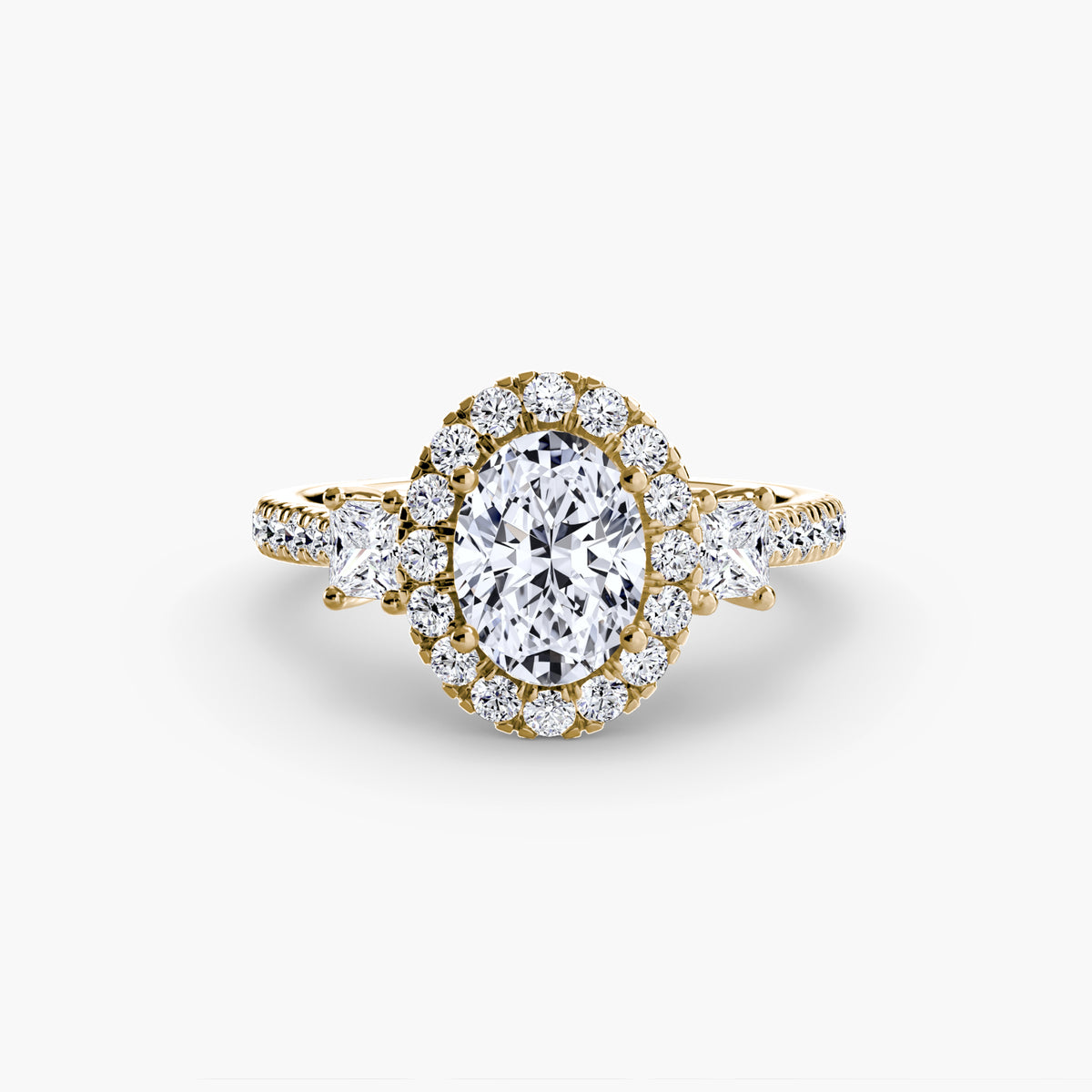 Aurore Oval Three-Stone Halo in yellow gold