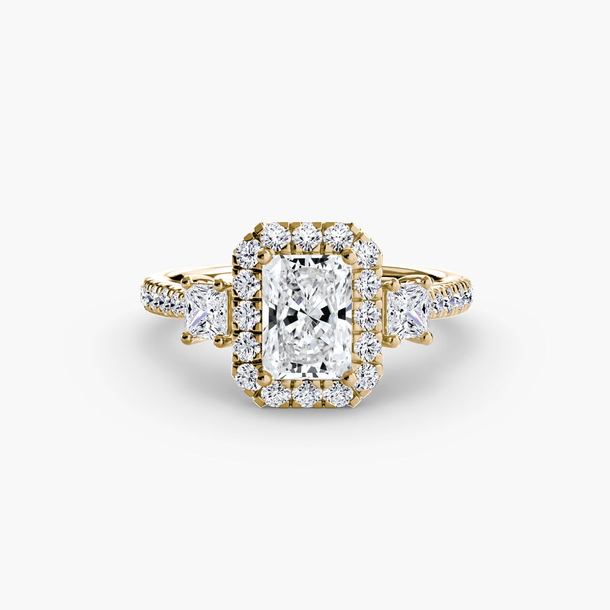 Inès Radiant Three-Stone Halo in yellow gold