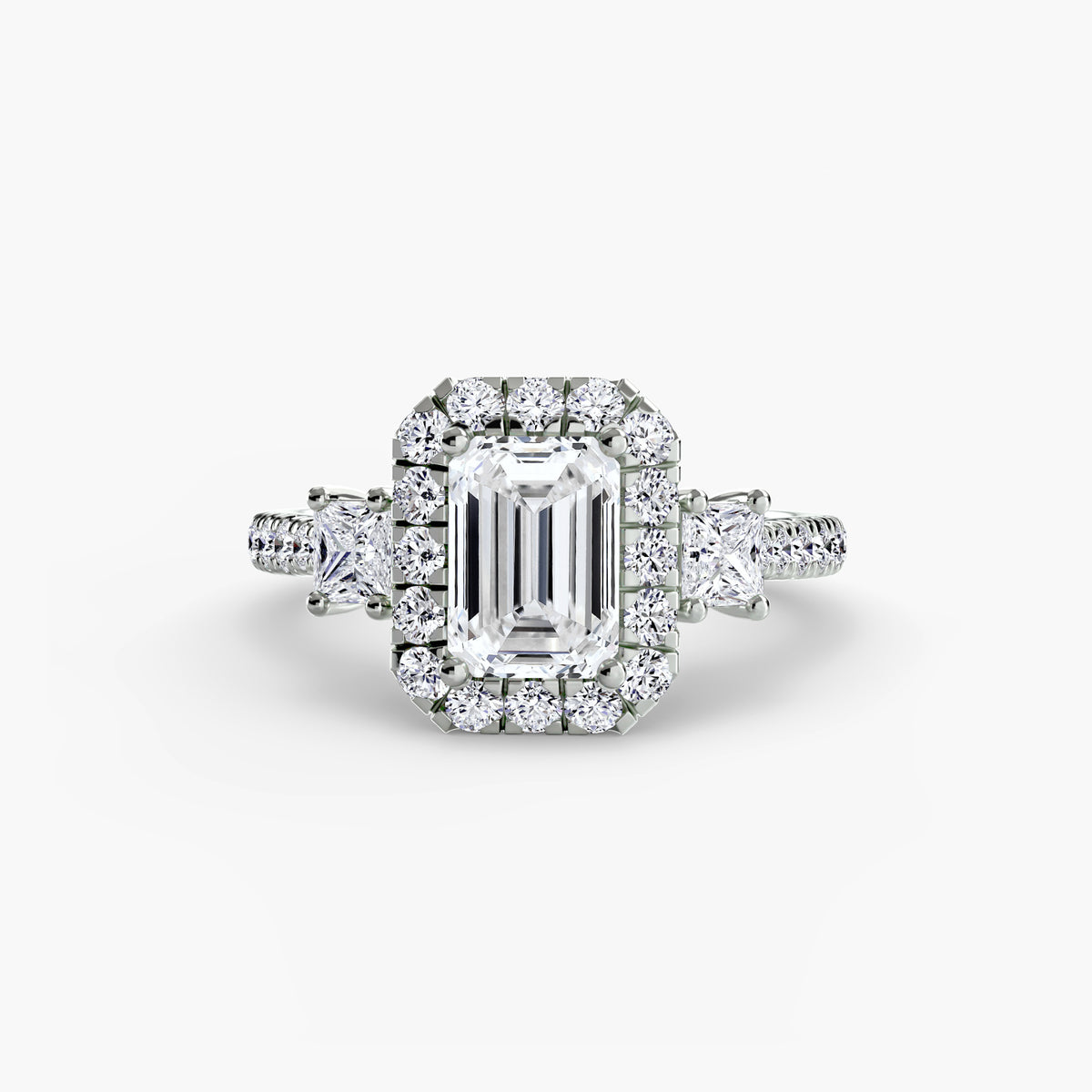 Guinevere Emerald Three-Stone Halo in white gold