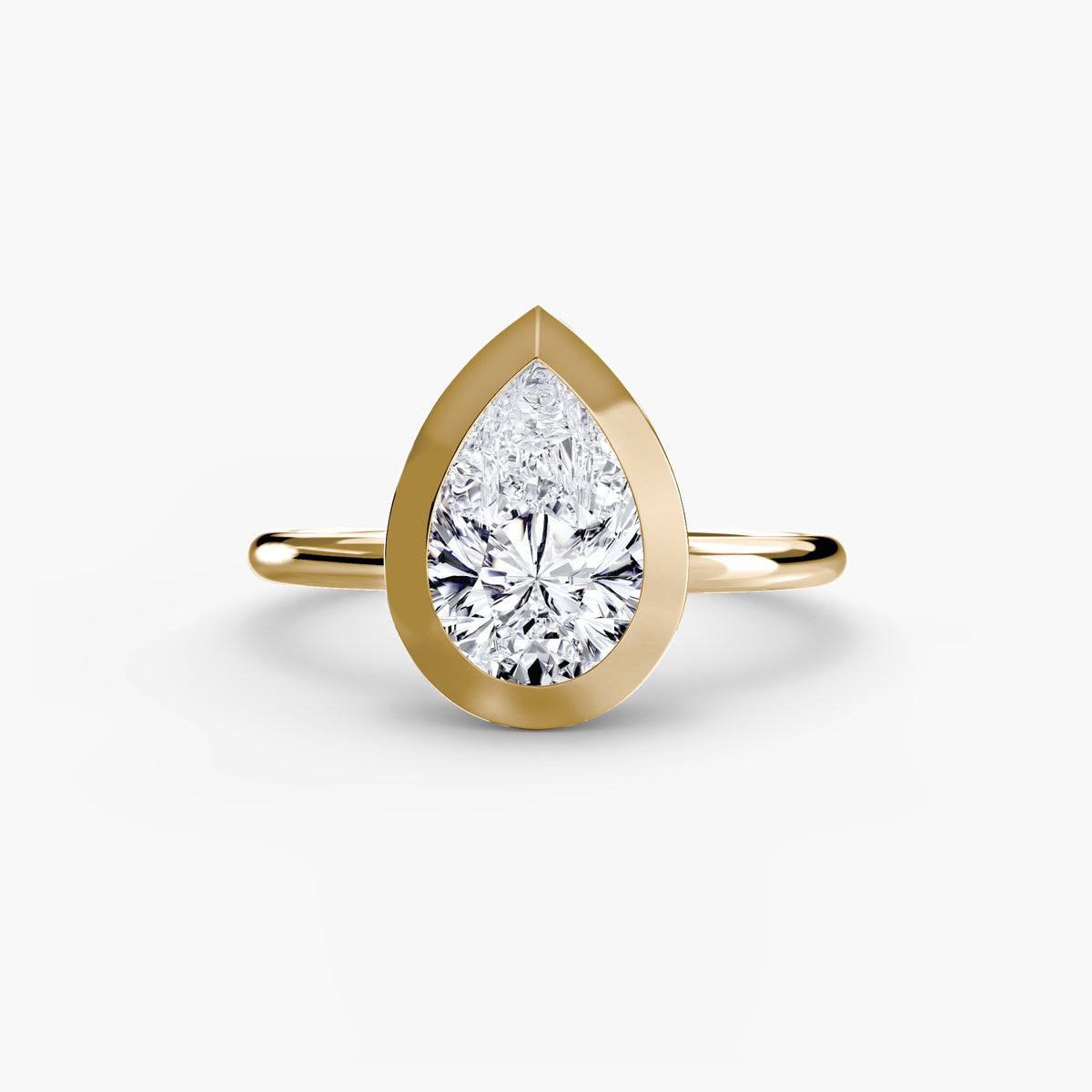 Willa Pear Bezel Solitaire in yellow gold