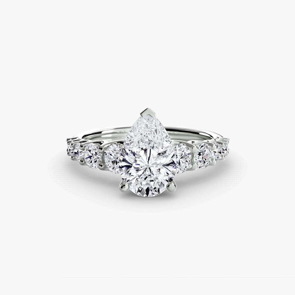 Lucienne Pear Graduated Accent in white gold