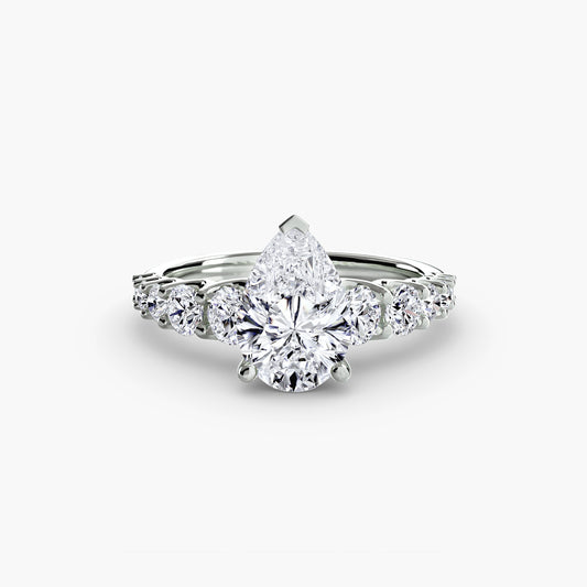 Lucienne Pear Graduated Accent in white gold